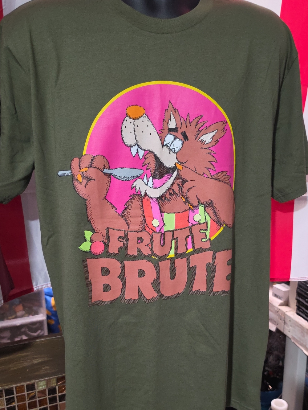 KAWS Olive Green "Frute Brute" Graphic Tee with Pink and Brown Art